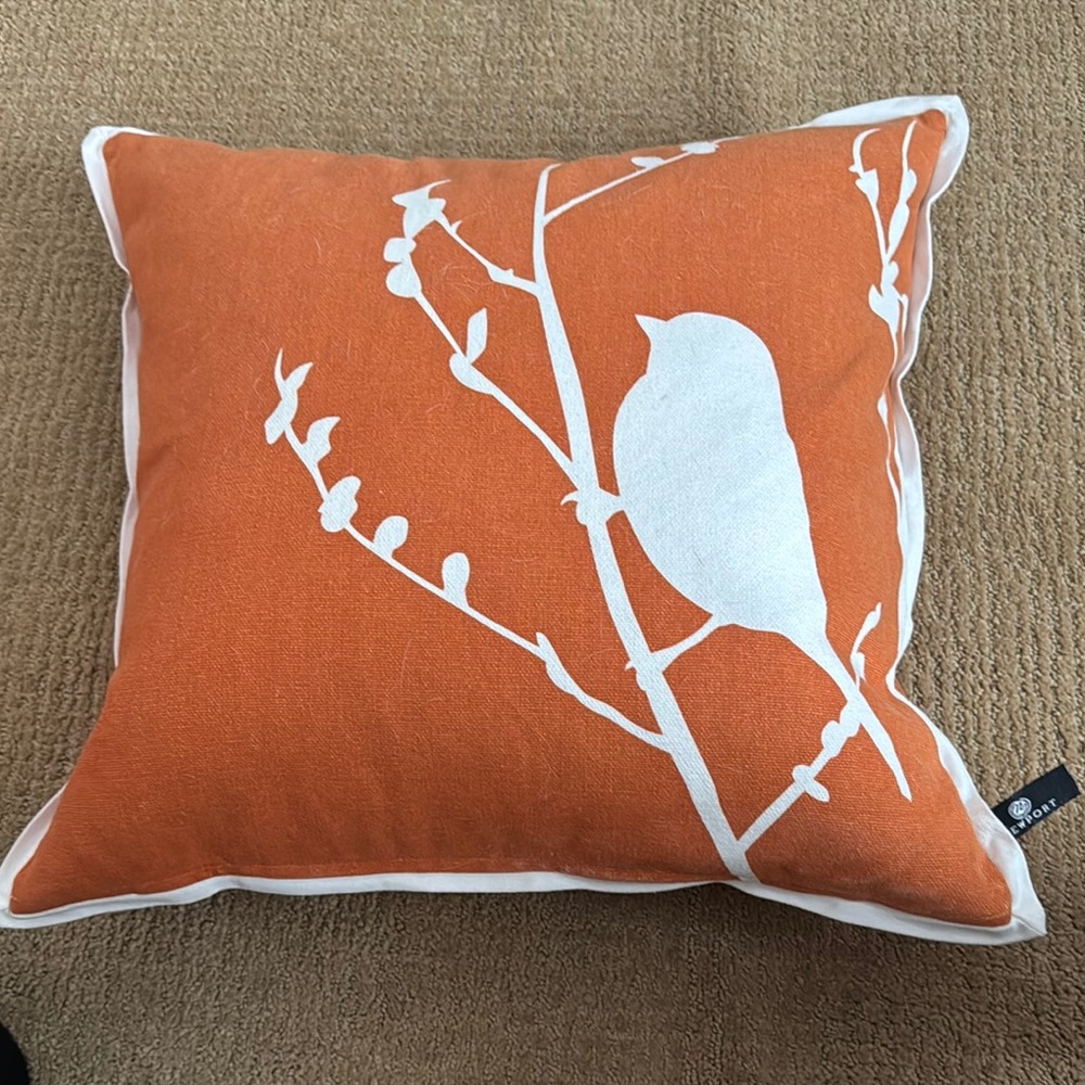Orange Pillow with Bird Design
